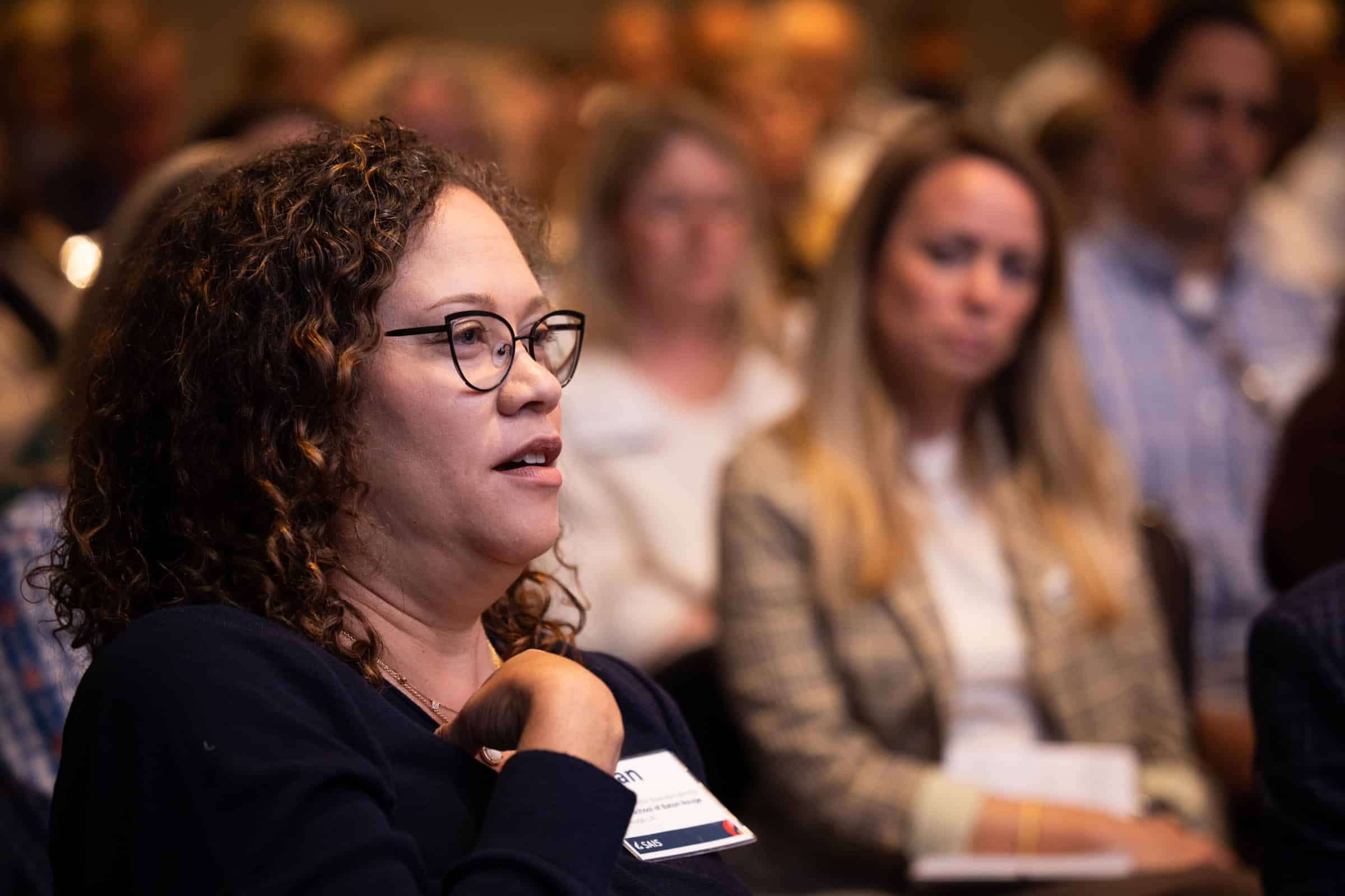 Conference attendee shares perspective during session