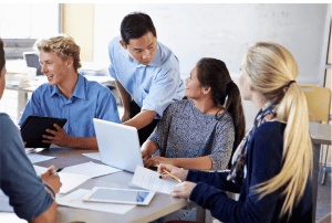 Team around laptop