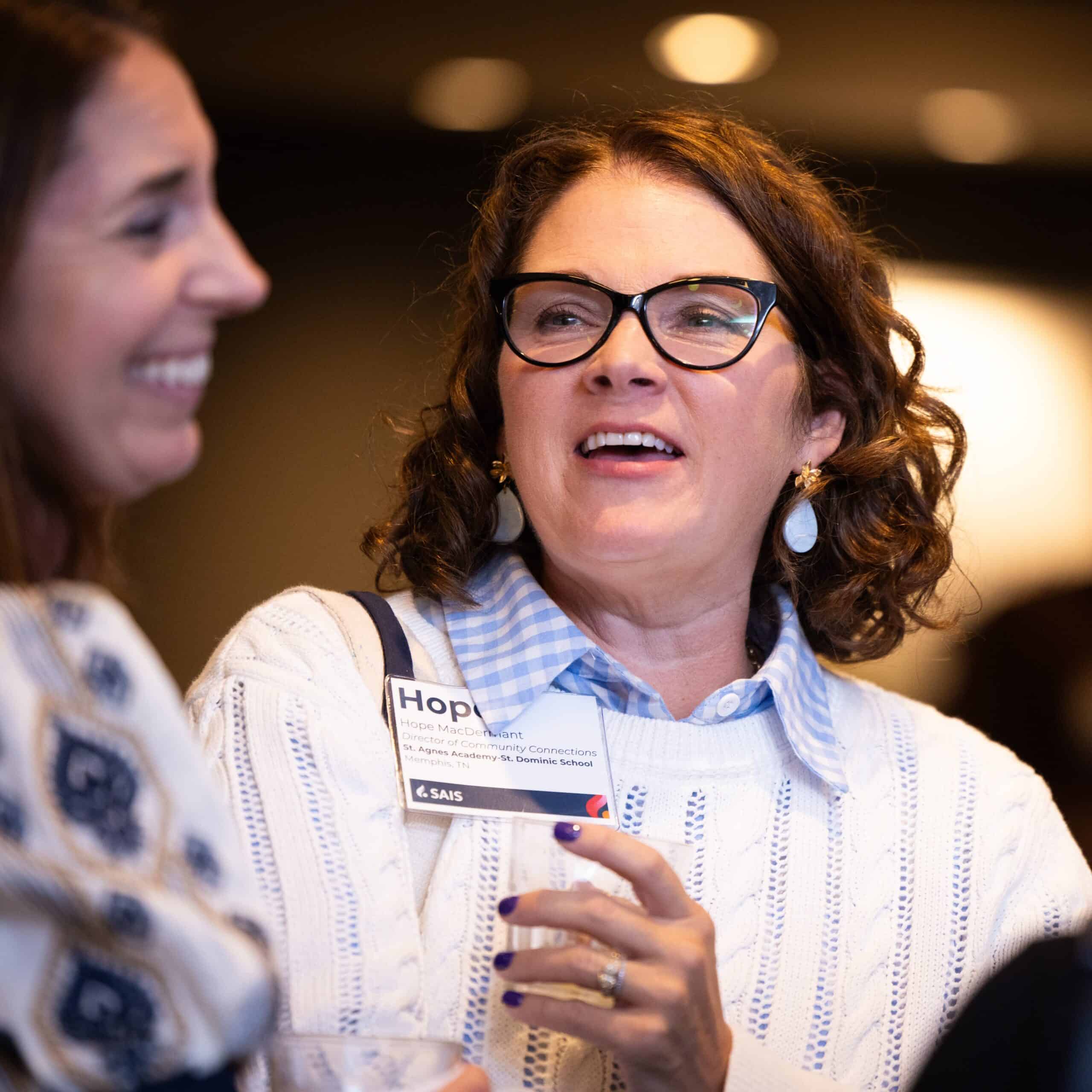 Two people talking during reception at a conference